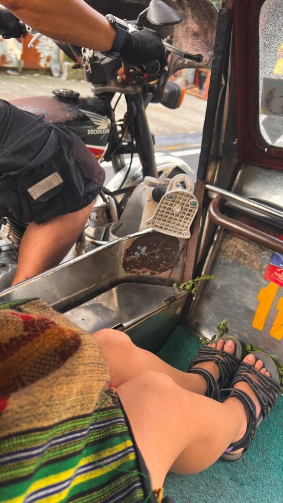 Wearing Teva sandals in a Tuk-tuk motorcycle.