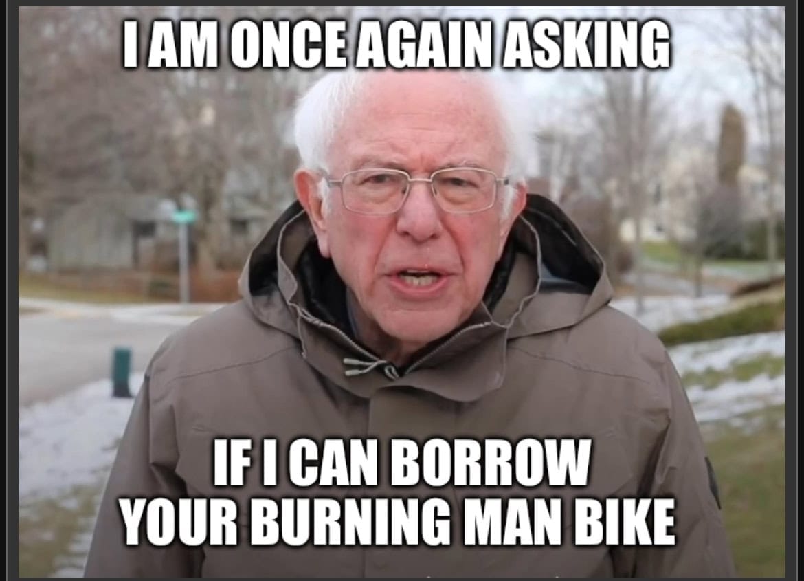 Meme of Bernie Sanders looking at the camera and the overlay text says "I am once again asking, if I can borrow your Burning Man bike." Relating borrowing a bike to save costs for Burning Man.
