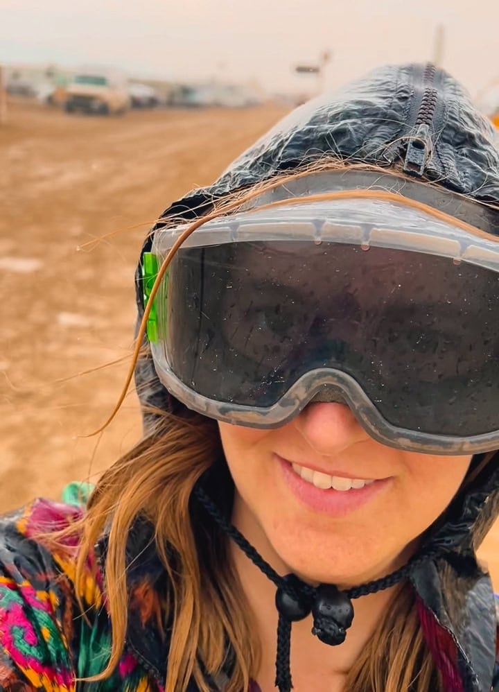 Tasha wearing UV protective goggles for dust and rain protection at Burning Man.